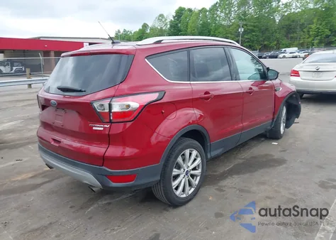 2017 Ford Escape Titanium z USA, uszkodzony, nr VIN 1FMCU0J97HUE84151
